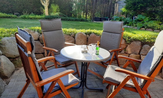 Ostseebad Kuhlungsborn Apartment | Cozy vacation apartment with natural stone terrace surrounded by greenery