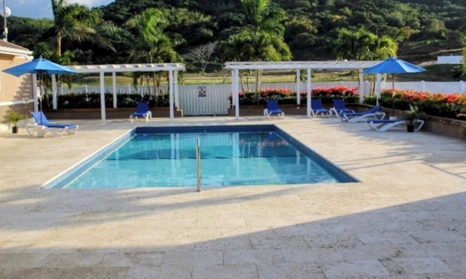 Lucea House | Cozy yet elegant Jamaican vacation home with access to pool, beach, gym etc