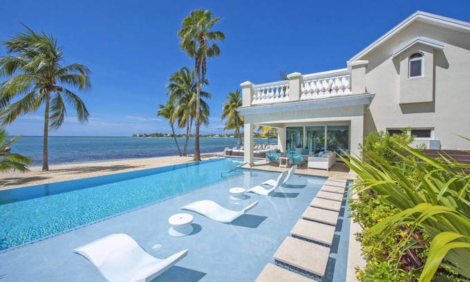 Rum Point House | Crystal Waters: Luxe Villa w/Private Pool, Dock and Barefoot Beach Lounge - Walk to The Kaibo!
