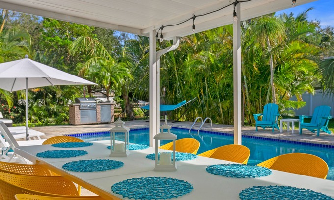 Palma Sola House | Custom coastal oasis with pool, game room, outdoor living, washer/dryer, & AC