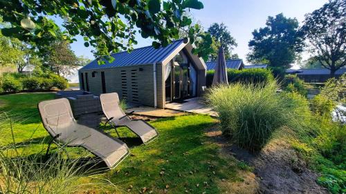 Hulshorst Ski Chalet | Das Holland Beachhouse, modern eingerichtet, in schöner Lage am Veluwemeer, inklusive Garten, Terrasse am Wasser, Parkplatz und WLAN