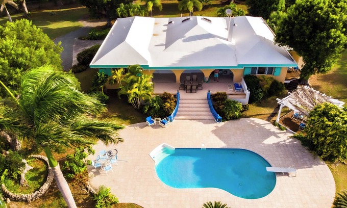 Sion Farm House | Deja Blue Large pool and yard over looking the Carribean Ocean