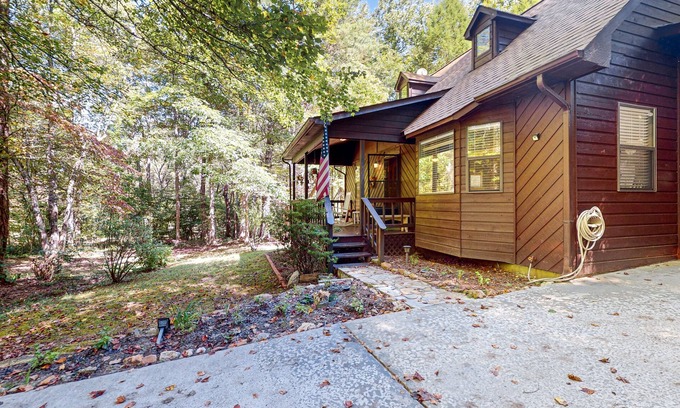 Blairsville Cabin | Delightful creekside cabin w/spacious deck, private hot tub, fire pit, & views