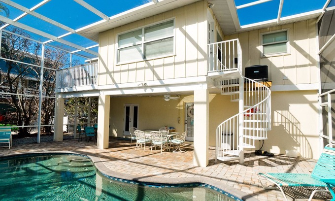 Anna Maria House | Desirable North-End Gem on Canal with Dock, Heated Pool. Clean and Spacious.