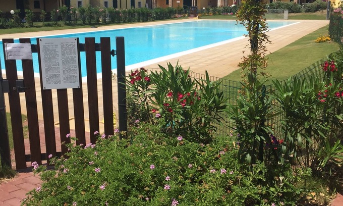Badesi Apartment | directly on the sea new apartment with garden and swimming pool