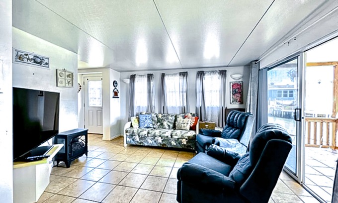 Port Isabel House | Dog-friendly bayfront home with in/outdoor pools, tennis, gym, W/D, bay views