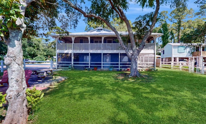 Eastpoint House | Dog friendly home overlooking the Gulf with classic veranda, yard & sunrise view
