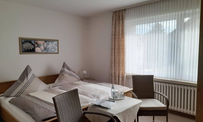 Bad Driburg Apartment | Double room, bathroom, WC - vacation apartment and guest room Iburgblick