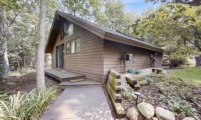 Glen Arbor Cottage | Downtown cottage with nearby beach access, a grill, deck, & washer/dryer