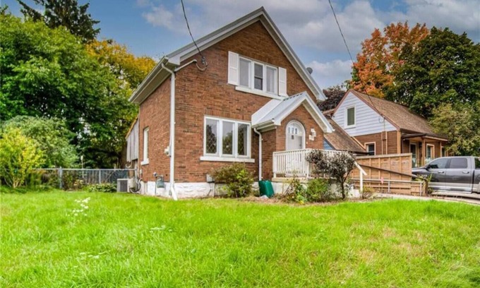 Kitchener House | Downtown House: Patio - Fire Pit - Lawn Chairs