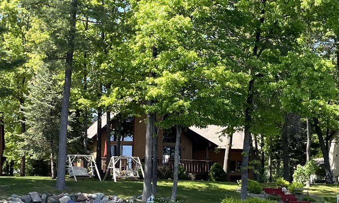 Gladwin Ski Chalet | Dream Cottage w/ Sandy Beach, Dock, Pontoon Rental