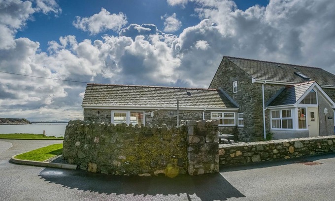 Holyhead Cottage | Efail Penrhyn - an on the beach that sleeps 6 guests in 3 bedrooms