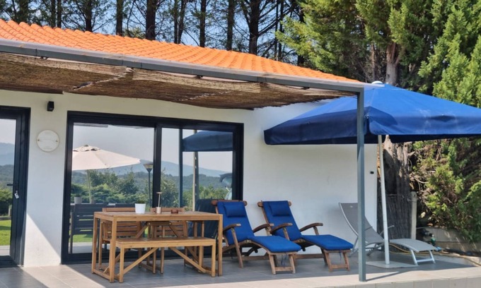 Peso Apartment | Elegant and private, with lawn out front and set back from the pool for added seclusion. Features Marshall speaker, plush robes, handmade herbal bath products and a sommelier-selected wine bottle for an exclusive stay.