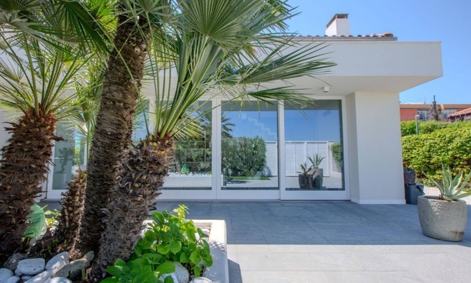 Marzocca Villa | Elegant beachfront villa with jacuzzi, garden, and panoramic terrace.