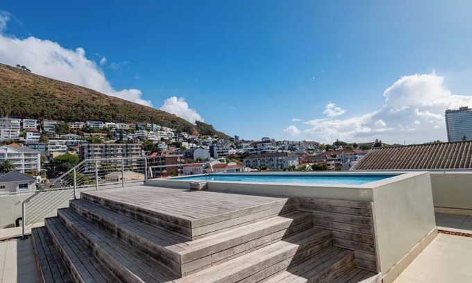 Flora Park Apartment | Elegant Green Point Escape | Views |Pool
