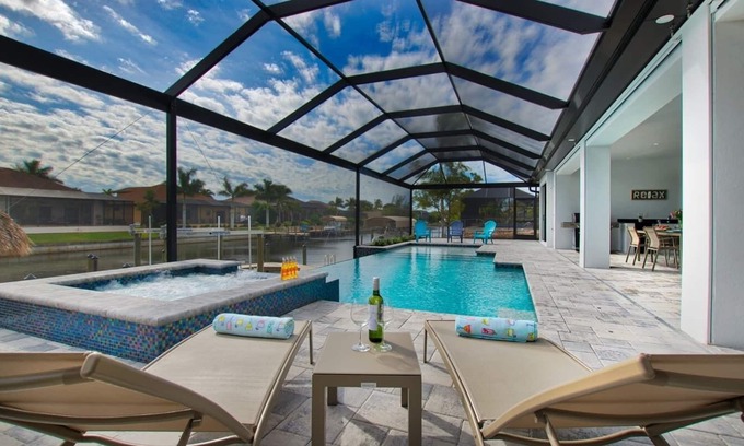 Pelican House | Elegant Modern Home on Salt Water Canal w/Heated Pool
