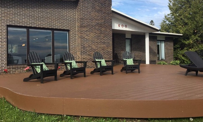 St Ignace House | Enjoy cool breezes, take in lake and island views from this updated modern home.