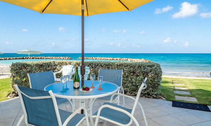 Seven Mile Beach Condo | Enjoy Gorgeous Views & Sunsets Right from the Patio of this Oceanfront Unit!