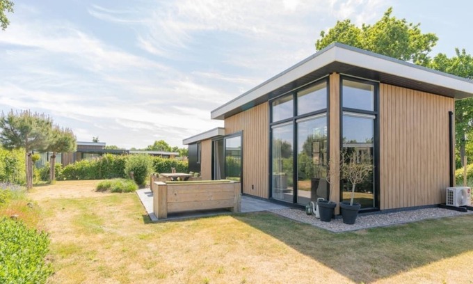 Burgh-Haamstede House | Enjoy the outdoors in this luxury chalet at Duinvilla’s Schouwenduin with a large sliding door, high