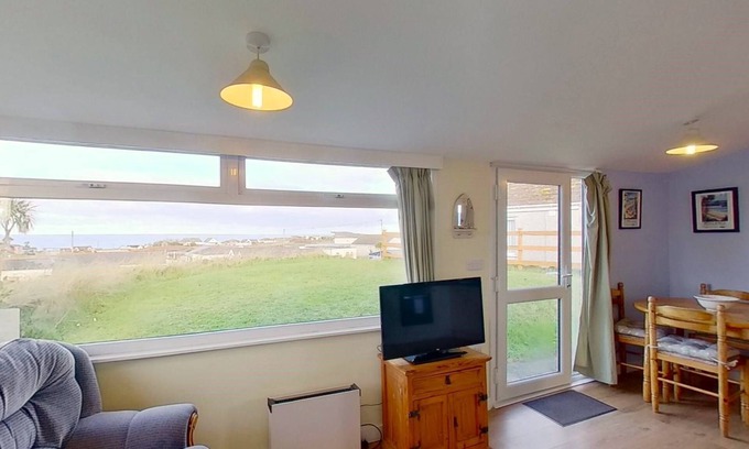 Hayle Cottage | Enjoying views towards St. Ives Bay and the Atlantic Branksea offers comfortable space to cosy down