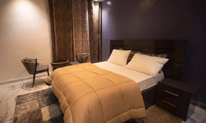 Kumasi Apartment | Exec 2BR Aptmt with modern kitchen, WiFi, cozy bedrooms, study area, and hall