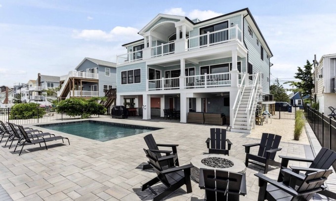Ship Bottom House | Expansive Bayfront Home w/Heated Saltwater Pool & Dock