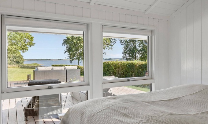 Kirke Hyllinge House | Experience a wonderful break in this holiday home with fjord views.