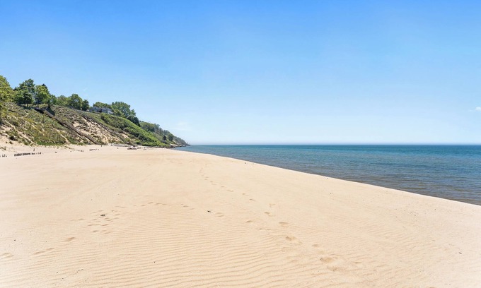 Port Sheldon House | Experience luxury at Lakefront Villa, a spacious 5-bedroom retreat - stunning lake views.