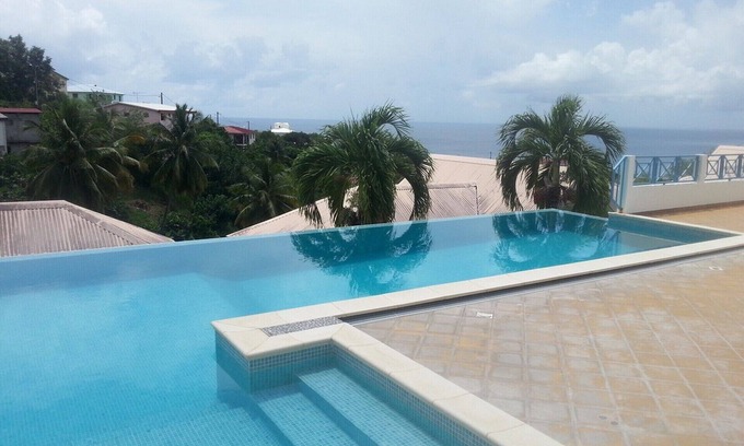Le Carbet Apartment | F2 Panoramic view sea, mountain and swimming pool view of the residence