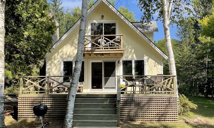 Lake Leelanau Cottage | Fall 2025 open, stunning, cozy, sunset waterfront on N Lake Leelanau.