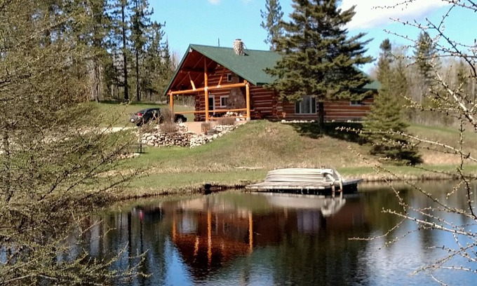 Perronville Cabin | Family friendly comfy log lodge and pond.