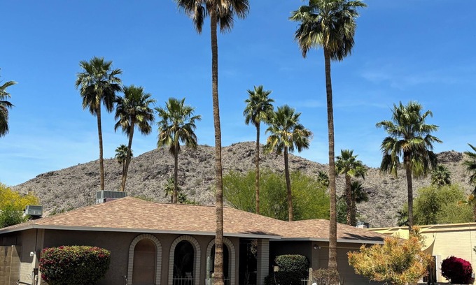 Desert Foothills Estates House | Family oasis with heated pool, desert landscaping and South Mountain views.