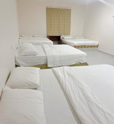 Bukit Kecil House | Family room with private bathroom