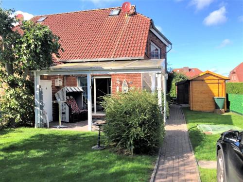Neßmersiel House | Ferienhaus Huus Wattenmeer in Nessmersiel mit Garten, Terrasse, Sauna, Räder, und Grill