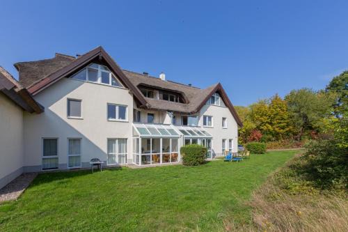Lobbe Apartment | Ferienwohnung Mohnblume - Strandhaus Lobbe