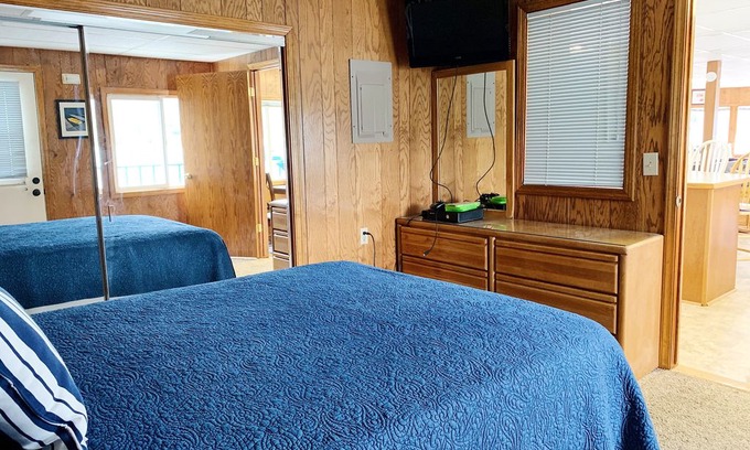 Somers Boat Rental | FLOATING HOUSE on Flathead Lake with waterside, kayaks, rooftop deck, and more