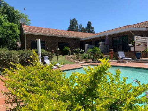 Lanseria House | Footprints Self Catering Indoor Heated Pool and Fireplaces