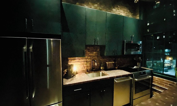 Seaport District Apartment | Fort Point Corner of Windows brick & beam loft