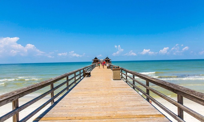 Naples Condo | Genoa Vacation Rental: Stylish 2-BR Condo with Golf & Lake Views. Resort-Style Pool, Hot Tub, and Easy Access to Championship Golf. Minutes from Naples Beaches, 5th Avenue S, and Marco Island