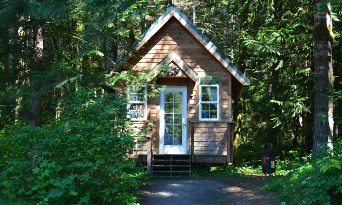 Ashford Cabin | Glamping at its finest in an adorable tiny home cabin that sleeps up to three! Shared hot tub. Beautiful property surrounding the cabin. Short stroll to Copper Creek. Walking distance to Copper Creek Restaurant. 2 miles to Mt Rainier National Park.