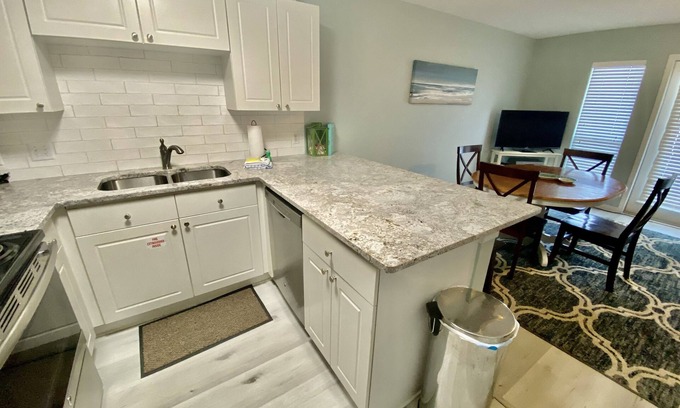 Gulf Place House | Great family condo, by pool, XL patio, 2 min walk to beach, food, shops, art,