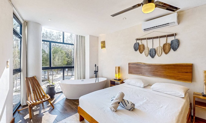 Zama Apartment | Ground-floor apt near downtown Tulum with rooftop pool, gym, soaking tub, & AC