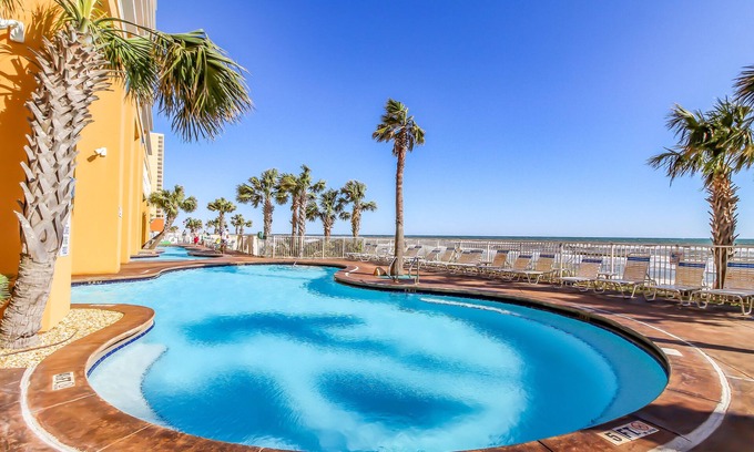 West Panama City Beach Condo | Gulf-front condo with beach access, pool, hot tub, lazy river, & beach chairs