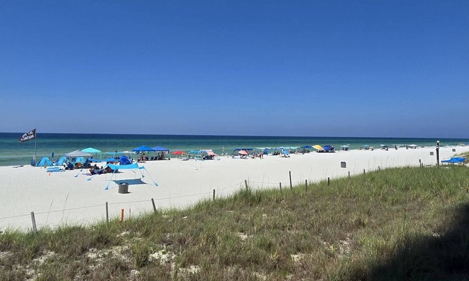 Panama City Beach Condo | Gulf front primary with king bed. Pools, hot tub, arcade and more!