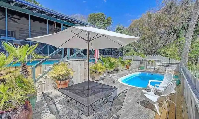 Folly Beach Cabin | Happy Landing, cheerful two bedroom cabin w/pool