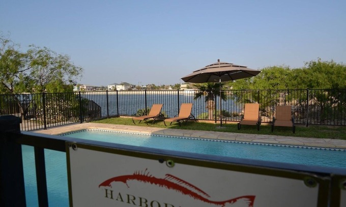 Port Mansfield Condo | Harbor's End Condos for Rent. Waterfront, Pool, Pier and Fish cleaning table .
