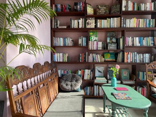 Can Tho House | Here Library - A wooden home by the river with a library