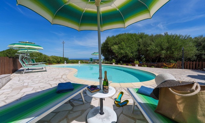 Aglientu Apartment | Holiday Apartment "Casa Ginepro Piscina E Vista Mare" with Sea View, Shared Pool & Wi-Fi