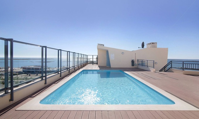 Olhao Apartment | Holiday Apartment "My Oasis Ll" with Sea View, Shared Pool & Wi-Fi