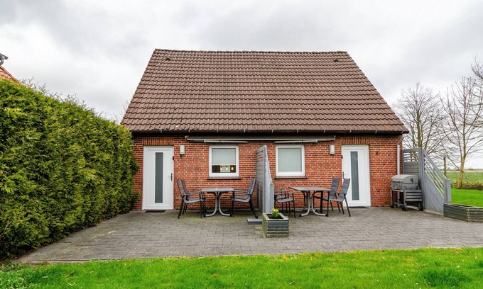 Wangerland Apartment | Holiday Apartment "Nordsee 1" with Shared Terrace, Shared Garden & Wi-Fi